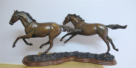 Bronze horse sculpture, Running Free, two horses galloping